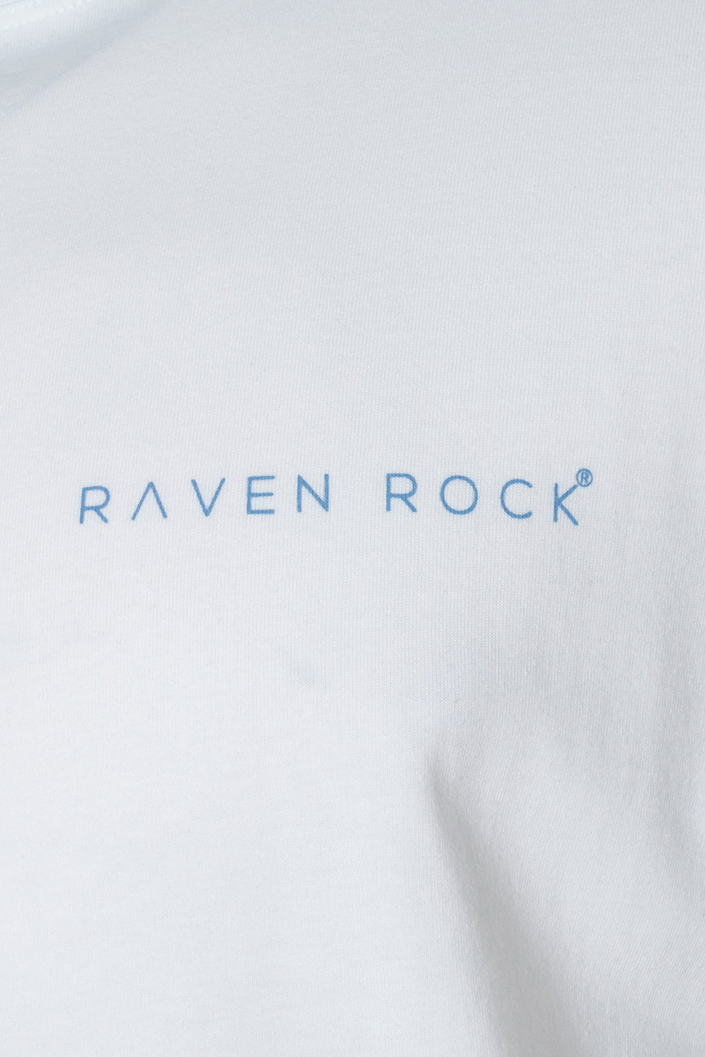 Close-up of chest logo on white British-made t-shirt – traceable cotton, UK production