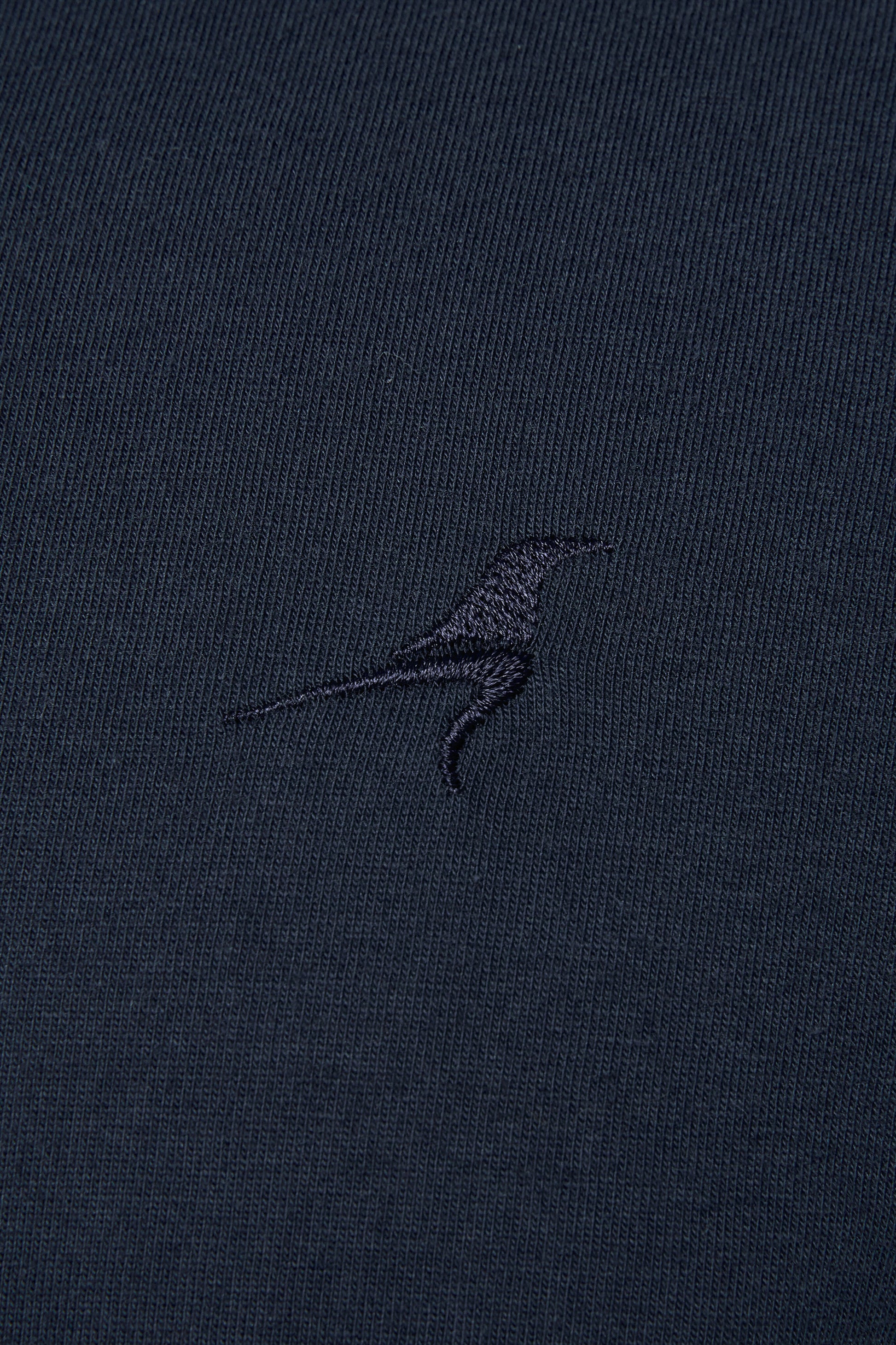 RAVEN ROCK embroidered bird on chest of navy t-shirt