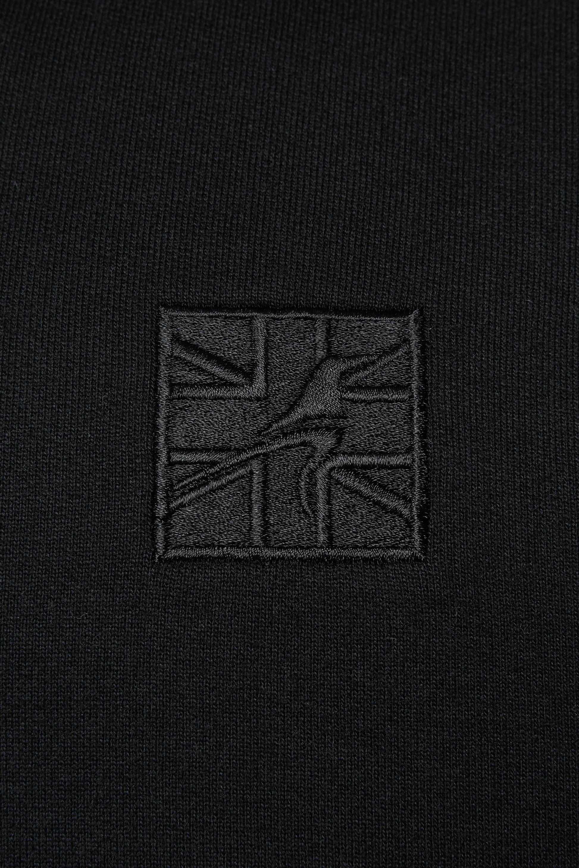 Embroidered black logo on a men's black hoodie