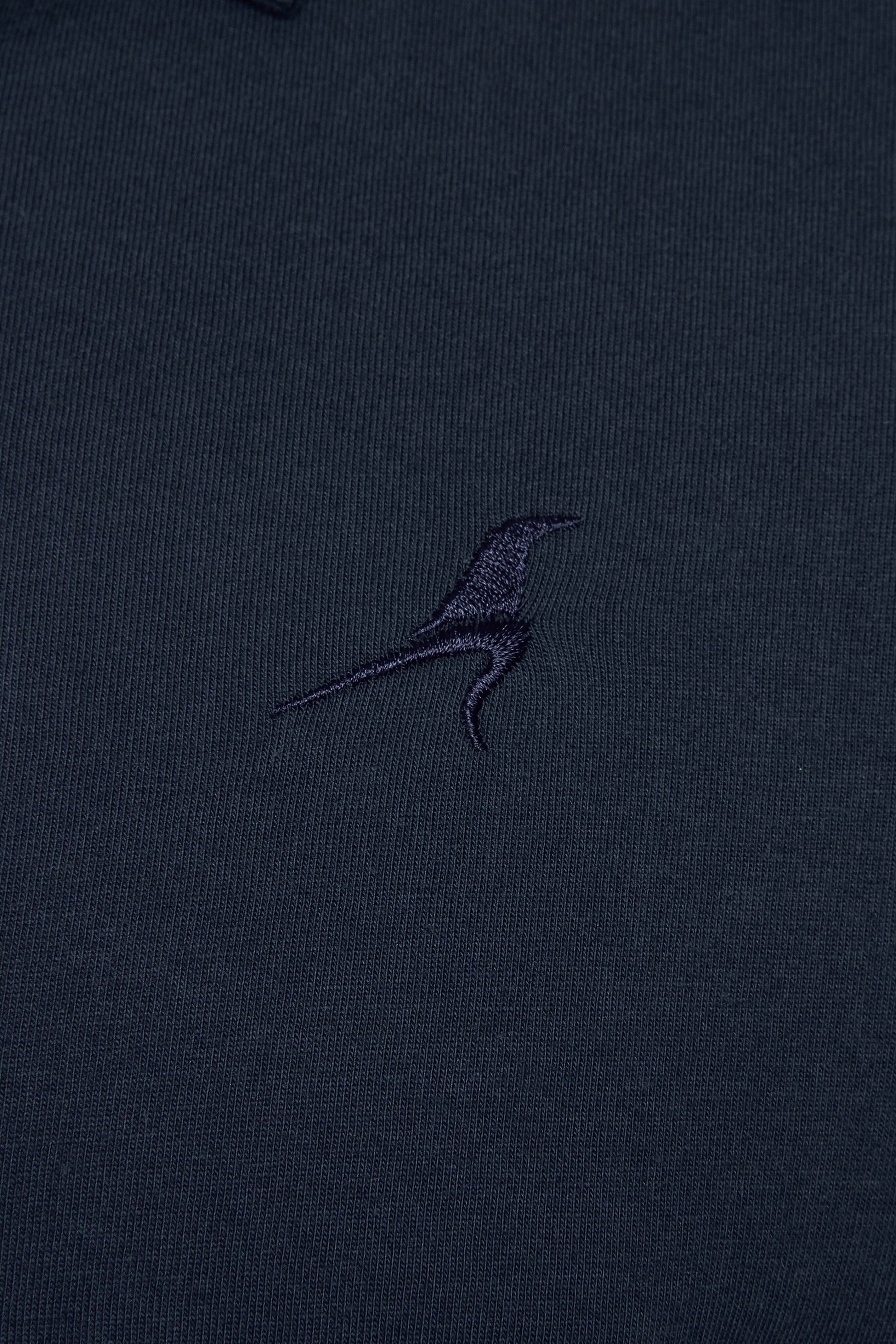 Navy blue shirt with a small embroidered logo 