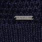 Close-up of a dark blue wool yarn  with 'RAVEN ROCK' branding.